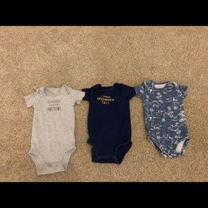 Three Carter’s onesies.